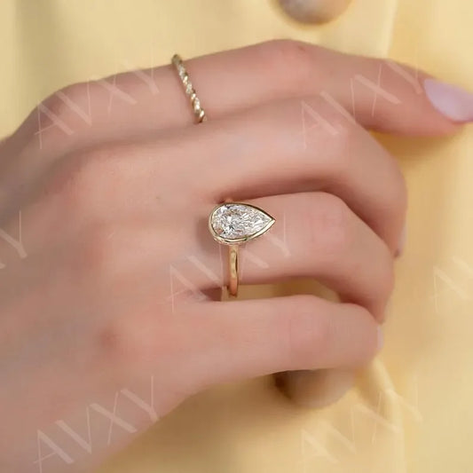 Pear 2.00ct lab grown diamond engagement ring bezel hidden halo IGI certified ethical sustainable bridal proposal ring luxury fine jewelry solitaire design