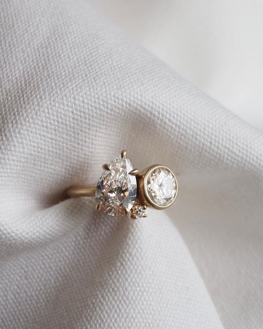 2ct Pear & Round Full Bezel Toi Et Moi Lab Grown Diamond Ring Delicate gold band featuring princess-cut diamonds, designed for refined elegance. Statement gold ring with a radiant diamond centerpiece, ideal for a bold look. YouTube Amazon Facebook Weather Google Gmail Wordless WhatsApp Web Translate News blog post ring ceremony Article Life Money 2025 design Ring Ceremony Diamond Shape Diamond Ring Surat Diamond India Market Diamond Ring for Her Diamond Ring for Men Diamond Ring Women Engagement Ring