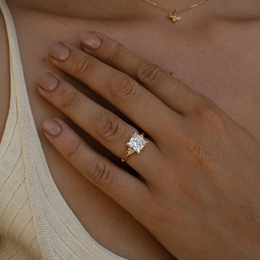 5ct Princess Cut Center & Both Side Round Cut Tiny Lab Grown Diamond Ring Classic diamond solitaire on a sleek gold band, highlighted on a manicured hand, perfect for wedding and engagement themes. diamond ring, gold engagement ring, luxury bridal jewelry, wedding accessories YouTube Amazon Facebook Weather Google Gmail Wordless WhatsApp Web Translate News blog post ring ceremony Article Life Money 2025 design Ring Ceremony Diamond Shape Diamond Ring Surat Diamond India Market Diamond Ring for Her Diamond