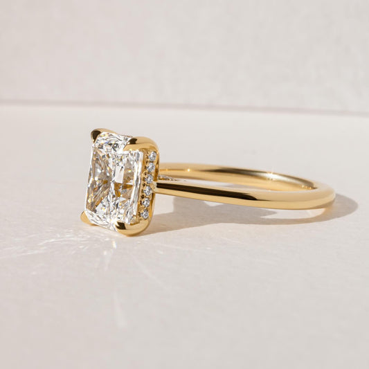 7ct Radiant Cut Juliette Setting with Hidden Halo Lab grown Diamond Ring The hand displays a soft, natural manicure, highlighting the diamond's brilliance and the ring's refined craftsmanship. Ideal for those seeking timeless, high-end accessories for special occasions. YouTube Amazon Facebook Weather Google Gmail Wordless WhatsApp Web Translate News blog post ring ceremony Article Life Money 2025 design Ring Ceremony Diamond Shape Diamond Ring Surat Diamond India Market Diamond Ring for Her Diamond Ring