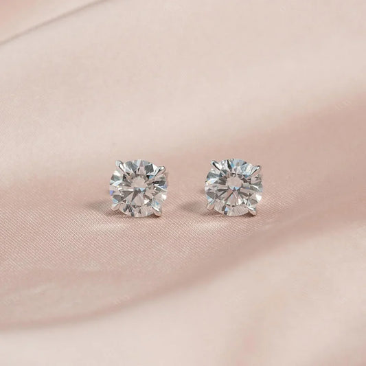 The 4 CTW Stud Earrings set with Round cut diamonds in white gold