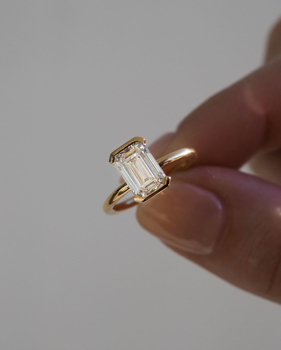 1.5ct Emerald Half Bezel Solitaire Diamond Ring featured on a hand with a minimalist manicure. Ideal for bridal jewelry collections, luxury fashion, or romantic proposal moments. YouTube Amazon Facebook Weather Google Gmail Wordless WhatsApp Web Translate News blog post ring ceremony Article Life Money 2025 design Ring Ceremony Diamond Shape Diamond Ring Surat Diamond India Market Diamond Ring for Her Diamond Ring for Men Diamond Ring Women Engagement Ring Finger For Her Finger Ring Gold Ring Bluestone Ring