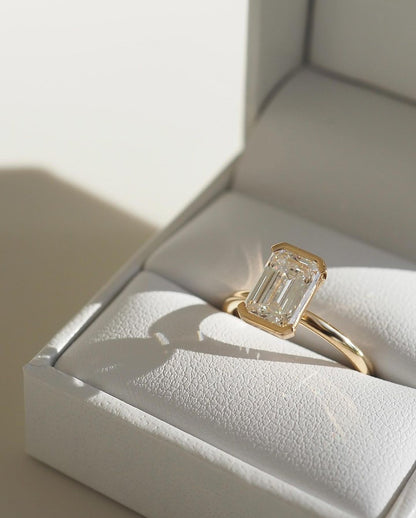 1.5ct Emerald Half Bezel Solitaire Diamond Ring Wedding Ring,  the ring's refined craftsmanship. Ideal for those seeking timeless, high-end accessories for special occasions. YouTube Amazon Facebook Weather Google Gmail Wordless WhatsApp Web Translate News blog post ring ceremony Article Life Money 2025 design Ring Ceremony Diamond Shape Diamond Ring Surat Diamond India Market Diamond Ring for Her Diamond Ring for Men Diamond Ring Women Engagement Ring Finger For Her Finger Ring Gold