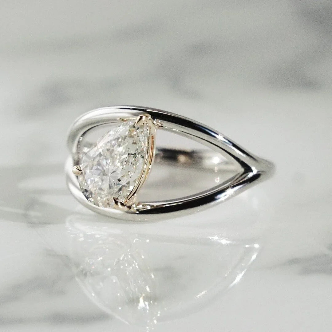 Pear cut lab grown diamond two-tone split shank engagement ring 1.40ct, IGI certified, modern bridal jewelry, sustainable luxury