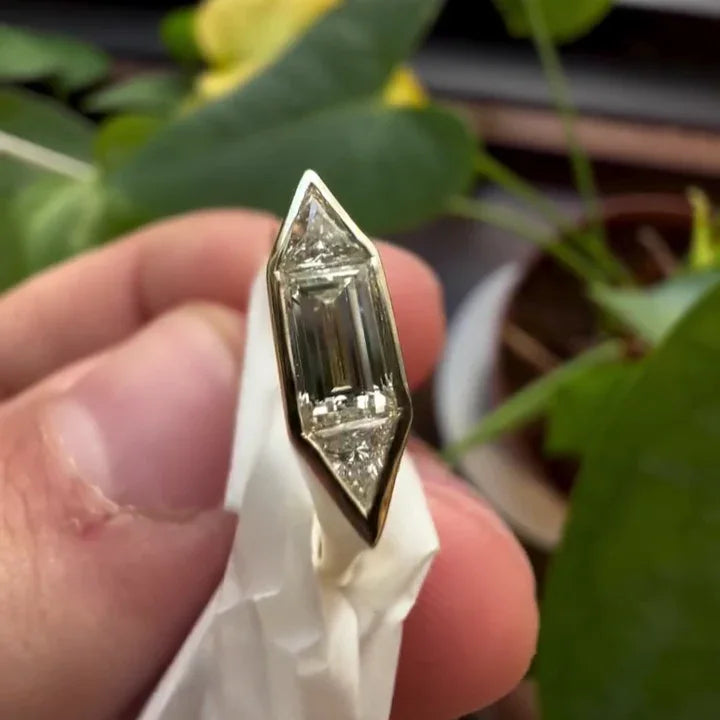 Modern 1.40TCW lab grown diamond engagement ring with baguette and trillion cuts, bezel setting, IGI certified fine bridal jewelry