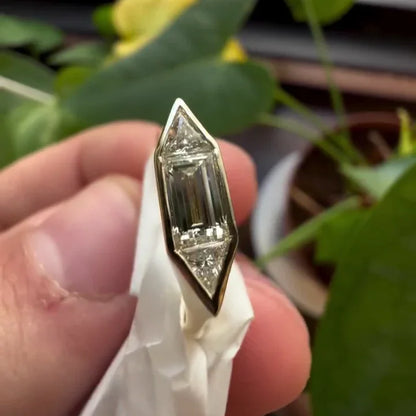 Modern 1.40TCW lab grown diamond engagement ring with baguette and trillion cuts, bezel setting, IGI certified fine bridal jewelry