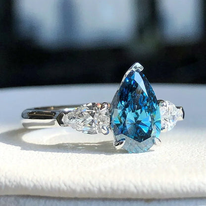 1.50 CT Fancy Blue Pear Lab Grown Diamond Engagement Ring | 0.50 CT White Pear Side Stones | 3-Stone Ring | IGI Certified 