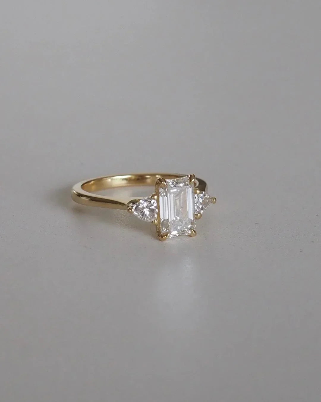 1.50ct lab created emerald diamond engagement ring, two trillion cut side stones, IGI certified fine jewelry, modern bridal ring for women