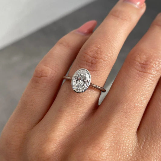 1.50ct oval lab grown diamond engagement ring, bezel setting, IGI certified bridal jewelry, modern wedding ring for women, ethical diamond ring