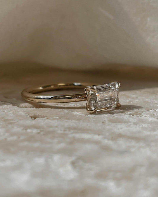 1ct Emerald Single Stone Lab Grown Diamond Ring Radiant gold-banded diamond engagement ring with a, displayed on a hand with a chic manicure for bridal and luxury jewelry lovers. modern engagement rings, premium wedding bands, or high-end diamond rings. YouTube Amazon Facebook Weather Google Gmail Wordless WhatsApp Web Translate News blog post ring ceremony Article Life Money 2025 design Ring Ceremony Diamond Shape Diamond Ring Surat Diamond India Market Diamond Ring for Her Diamond Ring for Men Diamond 