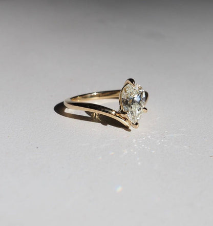 Close-up of a hand adorned with a sparkling  diamond ring on a sleek gold band, featuring a modern and elegant design. The ring is perfect for engagement, wedding, or luxury jewelry collections.  Close-up of a hand adorned with a sparkling  diamond ring on a sleek gold band, featuring a modern and elegant design. The ring is perfect for engagement, wedding, or luxury jewelry collections.