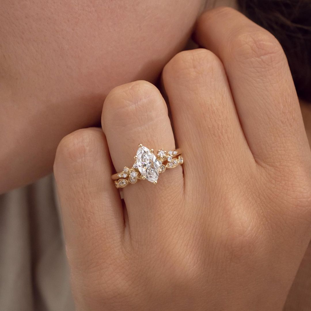 1ct Marquise Cut Lab Grown Diamond Ring  Exquisite gold engagement ring with a diamond, styled for luxury, weddings, and proposal inspiration photography. modern engagement rings, premium wedding bands, or high-end diamond rings. YouTube Amazon Facebook Weather Google Gmail Wordless WhatsApp Web Translate News blog post ring ceremony Article Life Money 2025 design Ring Ceremony Diamond Shape Diamond Ring Surat Diamond India Market Diamond Ring for Her Diamond Ring for Men Diamond Ring Women Engagement Ring 