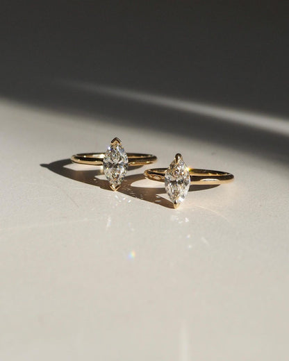 1ct Marquise Solitaire Diamond Ring Classic  diamond solitaire on a sleek gold band, highlighted on a manicured hand, perfect for wedding and engagement themes. diamond ring, gold engagement ring, luxury bridal jewelry, wedding accessories YouTube Amazon Facebook Weather Google Gmail Wordless WhatsApp Web Translate News blog post ring ceremony Article Life Money 2025 design Ring Ceremony Diamond Shape Diamond Ring Surat Diamond India Market Diamond Ring for Her Diamond Ring for Men Diamond Ring Women 