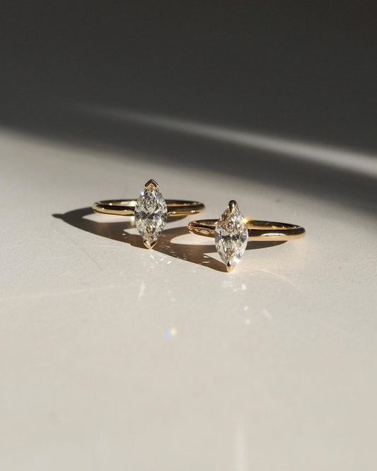 1ct Marquise Solitaire Diamond Ring Classic  diamond solitaire on a sleek gold band, highlighted on a manicured hand, perfect for wedding and engagement themes. diamond ring, gold engagement ring, luxury bridal jewelry, wedding accessories YouTube Amazon Facebook Weather Google Gmail Wordless WhatsApp Web Translate News blog post ring ceremony Article Life Money 2025 design Ring Ceremony Diamond Shape Diamond Ring Surat Diamond India Market Diamond Ring for Her Diamond Ring for Men Diamond Ring Women 