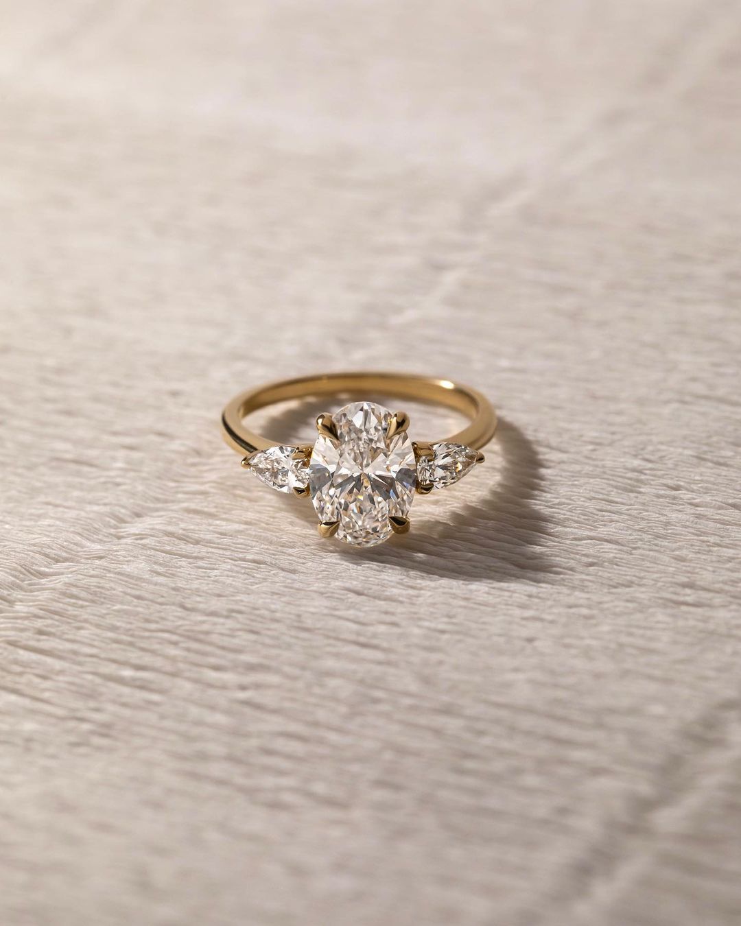 2.5ct Oval Cut Center Stone With Two side Pear Cut Luxury Diamond Ring on a Sleek Gold Band – Perfect for Engagements, Weddings, and Special Occasions  YouTube Amazon Facebook Weather Google Gmail Wordless WhatsApp Web Translate News blog post ring ceremony Article Life Money 2025 design Ring Ceremony Diamond Shape Diamond Ring Surat Diamond India Market Diamond Ring for Her Diamond Ring for Men Diamond Ring Women Engagement Ring Finger For Her Finger Ring Gold Ring Bluestone Ring Diamond Ring Price Gold 