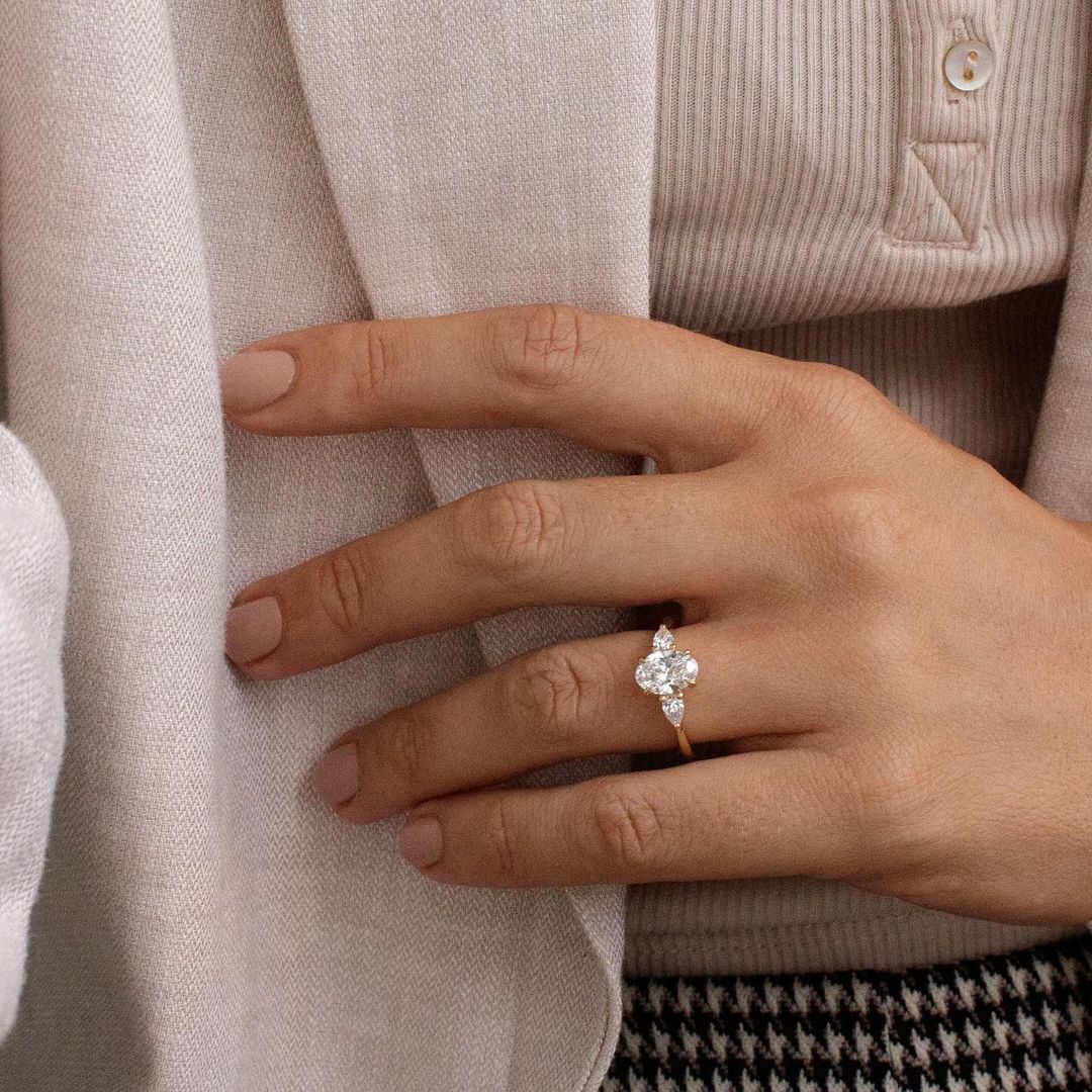 2.5ct Trio Lab Grown Diamond Ring  Close-up of a hand adorned with a sparkling  diamond ring on a sleek gold band, featuring a modern and elegant design. The ring is perfect for engagement, wedding, or luxury jewelry collections. YouTube Amazon Facebook Weather Google Gmail Wordless WhatsApp Web Translate News blog post ring ceremony Article Life Money 2025 design Ring Ceremony Diamond Shape Diamond Ring Surat Diamond India Market Diamond Ring for Her Diamond Ring for Men Diamond Ring Women Engagement Ring 
