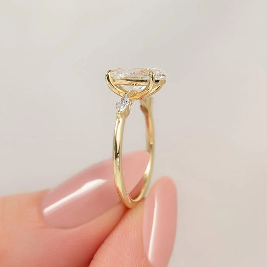 2.00ct oval cut lab grown diamond engagement ring side marquise accents IGI certified luxury bridal ring ethical sustainable proposal fine jewelry solitaire