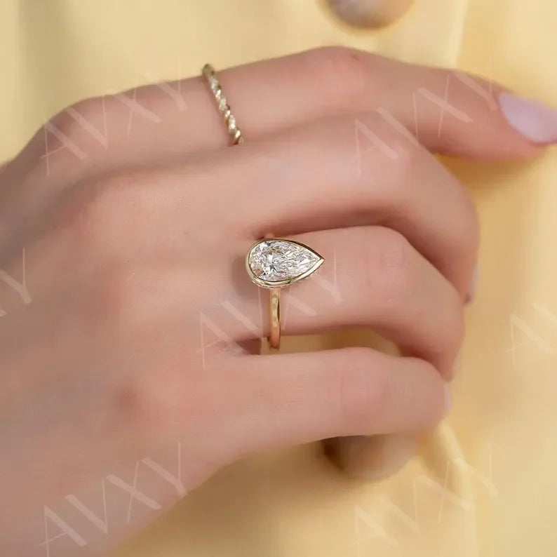 Pear 2.00ct lab grown diamond engagement ring bezel hidden halo IGI certified ethical sustainable bridal proposal ring luxury fine jewelry solitaire design