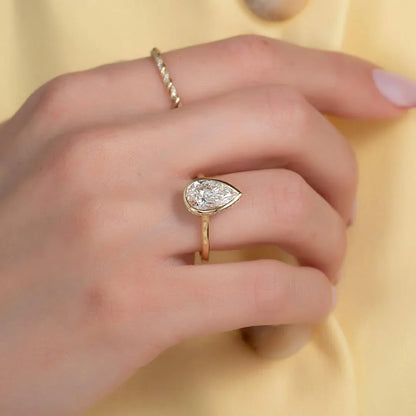 2.00ct pear cut lab grown diamond engagement ring bezel setting IGI certified bridal ring ethical sustainable luxury proposal fine jewelry solitaire