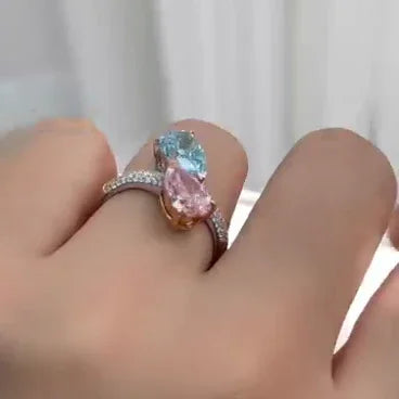 Elegant 2.50 TCW fancy pink and blue pear lab grown diamond engagement ring bypass style pavé band IGI certified luxury bridal jewelry ring