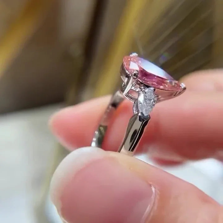 Fancy pink pear lab grown diamond 2.60 TCW engagement ring three stone IGI certified bridal ring luxury jewelry sustainable fine wedding ring design
