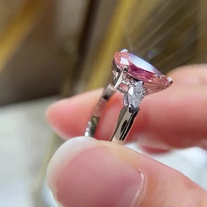 Fancy pink pear lab grown diamond 2.60 TCW engagement ring three stone IGI certified bridal ring luxury jewelry sustainable fine wedding ring design
