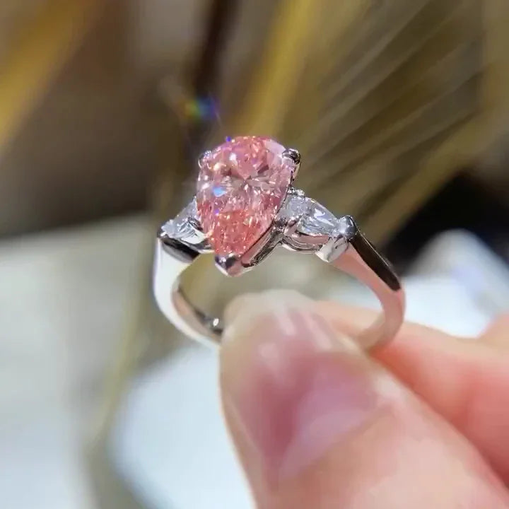IGI certified fancy pink pear lab grown diamond engagement ring 2.60 TCW three stone bridal ring luxury sustainable fine jewelry wedding ring style
