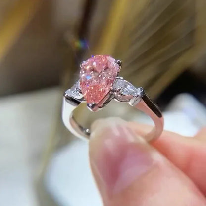 IGI certified fancy pink pear lab grown diamond engagement ring 2.60 TCW three stone bridal ring luxury sustainable fine jewelry wedding ring style
