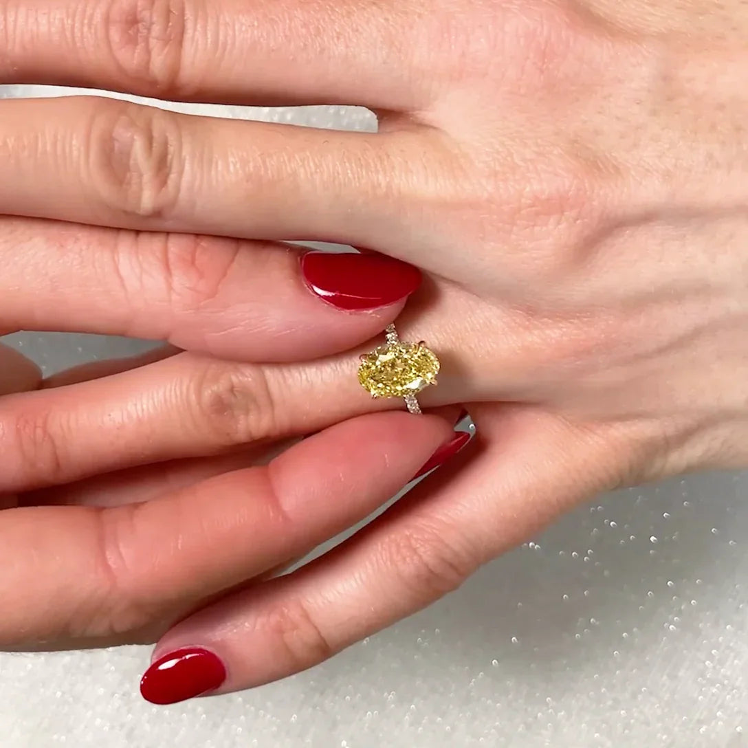 Fancy yellow oval cut lab grown diamond ring 2.90TCW, two-tone hidden halo setting, IGI certified wedding ring for women