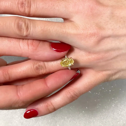 Fancy yellow oval cut lab grown diamond ring 2.90TCW, two-tone hidden halo setting, IGI certified wedding ring for women
