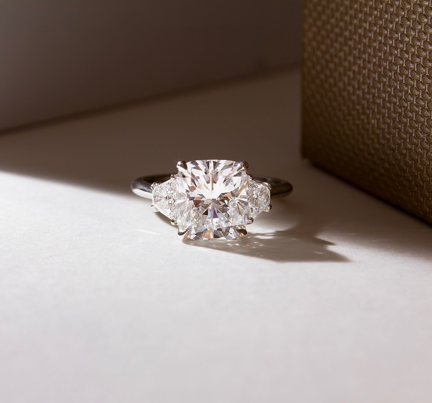 3.5ct Cushion Cut Trapezoid Lab Grown Diamond Ring  The hand displays a soft, natural manicure, highlighting the diamond's brilliance and the ring's refined craftsmanship. Ideal for those seeking timeless, high-end accessories for special occasions. YouTube Amazon Facebook Weather Google Gmail Wordless WhatsApp Web Translate News blog post ring ceremony Article Life Money 2025 design Ring Ceremony Diamond Shape Diamond Ring Surat Diamond India Market Diamond Ring for Her Diamond Ring for Men Diamond Ring 