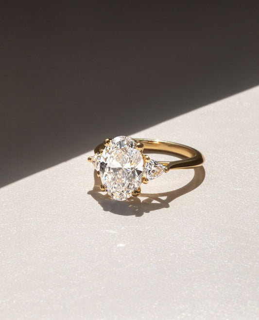 3.5ct Oval Cut Lab Grown Diamond Ring with Two Side Trillion Stone  Modern engagement rings, classic wedding accessories, or luxury jewelry inspiration. modern diamond ring, solitaire ring, premium jewelry, engagement ring, wedding jewelry. YouTube Amazon Facebook Weather Google Gmail Wordless WhatsApp Web Translate News blog post ring ceremony Article Life Money 2025 design Ring Ceremony Diamond Shape Diamond Ring Surat Diamond India Market Diamond Ring for Her Diamond Ring for Men Diamond Ring Women 