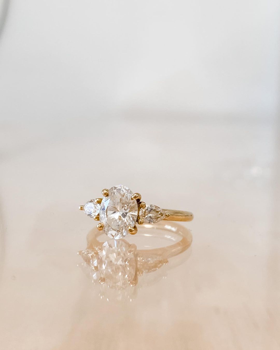 3ct Brilliant Oval Stone With Two Pear Shoulder Stones Lab grown Diamond Ring  Close-up of a hand adorned with a sparkling  diamond ring on a sleek gold band, featuring a modern and elegant design. The ring is perfect for engagement, wedding, or luxury jewelry collections. YouTube Amazon Facebook Weather Google Gmail Wordless WhatsApp Web Translate News blog post ring ceremony Article Life Money 2025 design Ring Ceremony Diamond Shape Diamond Ring Surat Diamond India Market Diamond Ring for Her Diamond Ring