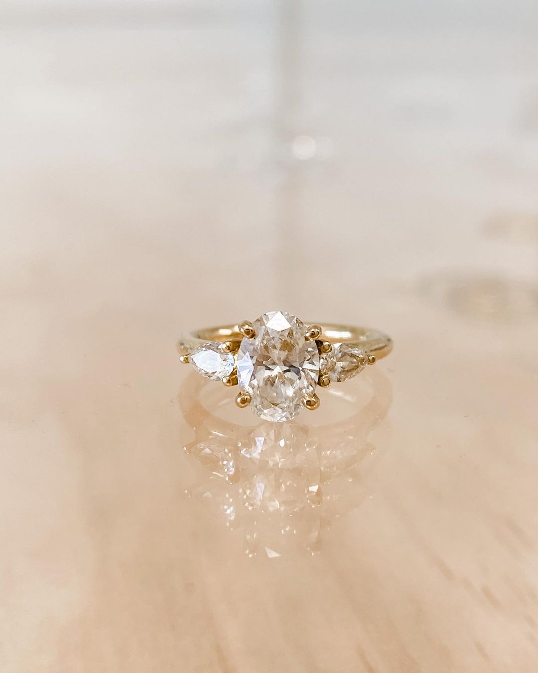 3ct Brilliant Oval Stone With Two Pear Shoulder Stones Lab grown Diamond Ring Classic  diamond solitaire on a sleek gold band, highlighted on a manicured hand, perfect for wedding and engagement themes. diamond ring, gold engagement ring, luxury bridal jewelry, wedding accessories  YouTube Amazon Facebook Weather Google Gmail Wordless WhatsApp Web Translate News blog post ring ceremony Article Life Money 2025 design Ring Ceremony Diamond Shape Diamond Ring Surat Diamond India Market Diamond Ring for Her 