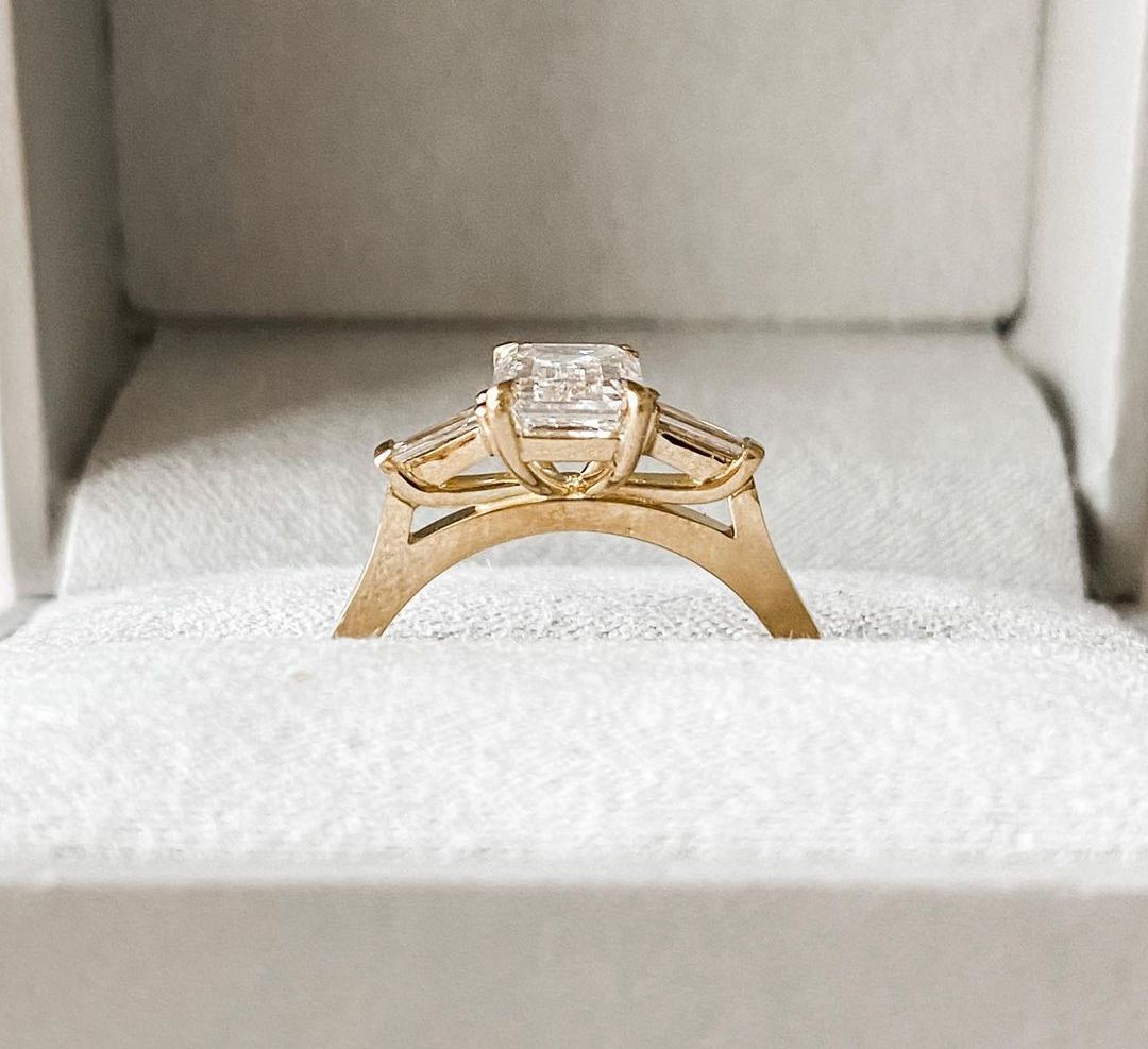 3ct Emerald Center Stone With Two Side Stone Lab Grown Diamond Ring  diamond engagement ring with a sleek gold band, featured on a hand with a minimalist manicure. Ideal for bridal jewelry collections, luxury fashion, or romantic proposal moments. YouTube Amazon Facebook Weather Google Gmail Wordless WhatsApp Web Translate News blog post ring ceremony Article Life Money 2025 design Ring Ceremony Diamond Shape Diamond Ring Surat Diamond India Market Diamond Ring for Her Diamond Ring for Men Diamond Ring 