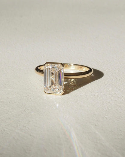 3ct Emerald Half Bezel Lab Grown Diamond Ring Sophisticated -cut diamond ring set in a classic gold band, beautifully neutral-toned nails. A must-have for engagement proposals, high-end jewelry lovers, and wedding occasions. YouTube Amazon Facebook Weather Google Gmail Wordless WhatsApp Web Translate News blog post ring ceremony Article Life Money 2025 design Ring Ceremony Diamond Shape Diamond Ring Surat Diamond India Market Diamond Ring for Her Diamond Ring for Men Diamond Ring Women Engagement Ring 