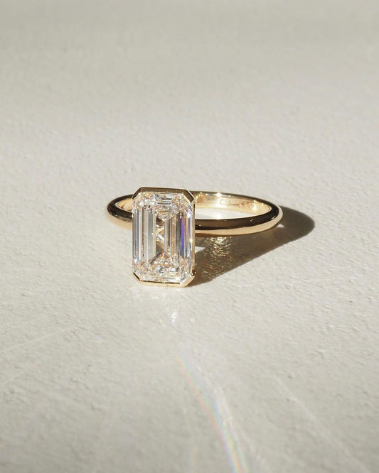 3ct Emerald Half Bezel Lab Grown Diamond Ring Sophisticated -cut diamond ring set in a classic gold band, beautifully neutral-toned nails. A must-have for engagement proposals, high-end jewelry lovers, and wedding occasions. YouTube Amazon Facebook Weather Google Gmail Wordless WhatsApp Web Translate News blog post ring ceremony Article Life Money 2025 design Ring Ceremony Diamond Shape Diamond Ring Surat Diamond India Market Diamond Ring for Her Diamond Ring for Men Diamond Ring Women Engagement Ring 