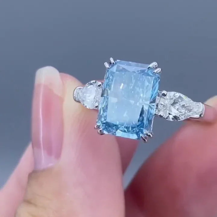 4.50 TCW Fancy Blue Radiant Lab Grown Diamond Engagement Ring | Pear Side Stone Design | IGI Certified 