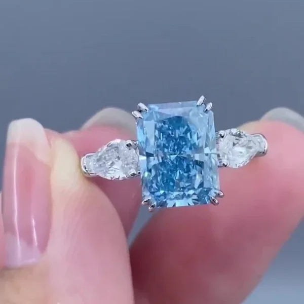 4.50 TCW Fancy Blue Radiant Lab Grown Diamond Engagement Ring | Pear Side Stone Design | IGI Certified 
