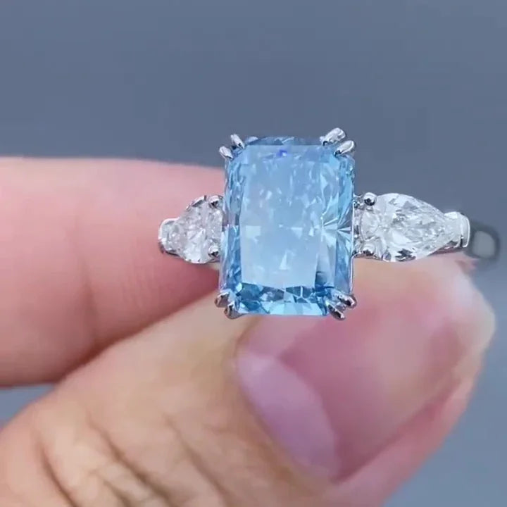 4.50 TCW Fancy Blue Radiant Lab Grown Diamond Engagement Ring | Pear Side Stone Design | IGI Certified