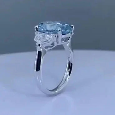 5.00 TCW fancy blue oval cut lab grown diamond ring, three stone engagement setting, IGI certified bridal jewelry