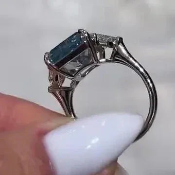 8.00 TCW radiant fancy blue lab grown diamond ring Cadillac side stone setting IGI certified engagement bridal wedding luxury jewelry gift women