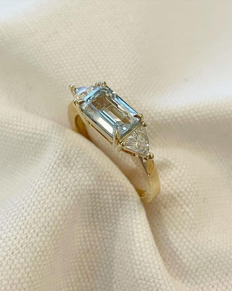 6ct Emerald cut Aquamarine stone set between two Trillion Cut Lab Grown Diamond Ring Trending Engagement Ring Designs – Perfect Wedding and Bridal Gift for Her