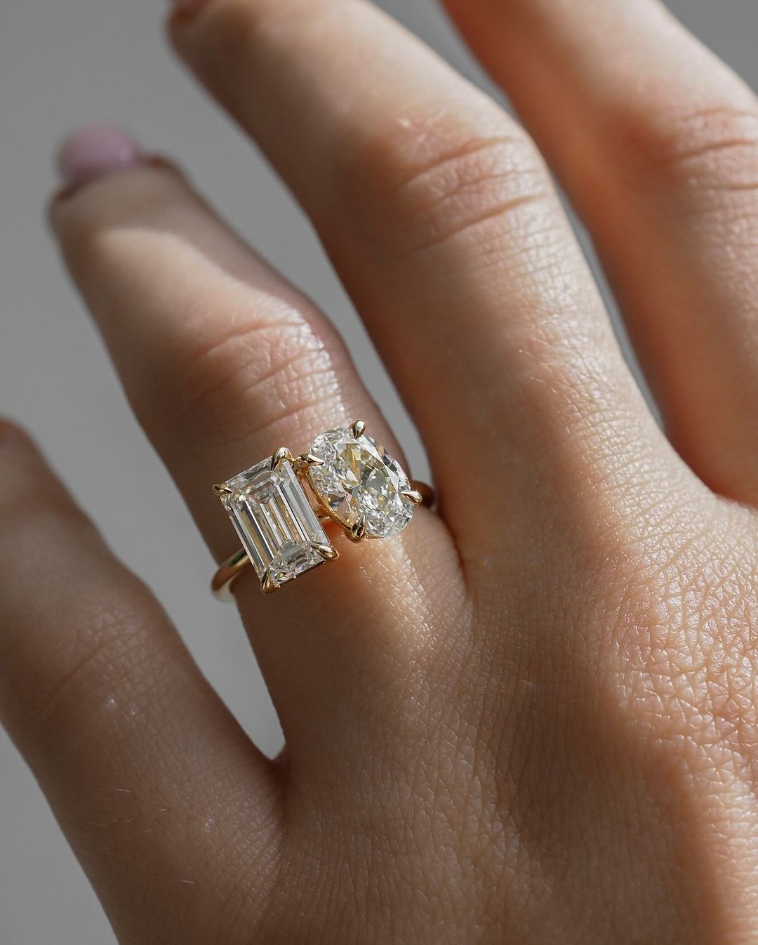 6tcw Emerald and Oval Cut Toi et Moi Lab Grown Diamond Ring Close-up of an exquisite gold-band ring featuring a diamond, ideal for engagement celebrations or luxury jewelry enthusiasts. The soft manicure enhances the refined and elegant appeal. YouTube Amazon Facebook Weather Google Gmail Wordless WhatsApp Web Translate News blog post ring ceremony Article Life Money 2025 design Ring Ceremony Diamond Shape Diamond Ring Surat Diamond India Market Diamond Ring for Her Diamond Ring for Men Diamond Ring Women 