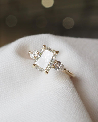 4ct Cushion Cut Center Diamond With Two Side Pear Cut Lab Grown Diamond Ring diamond engagement ring with a sleek gold band, featured on a hand with a minimalist manicure. Ideal for bridal jewelry collections, luxury fashion, or romantic proposal moments. YouTube Amazon Facebook Weather Google Gmail Wordless WhatsApp Web Translate News blog post ring ceremony Article Life Money 2025 design Ring Ceremony Diamond Shape Diamond Ring Surat Diamond India Market Diamond Ring for Her Diamond Ring for Men Diamond 