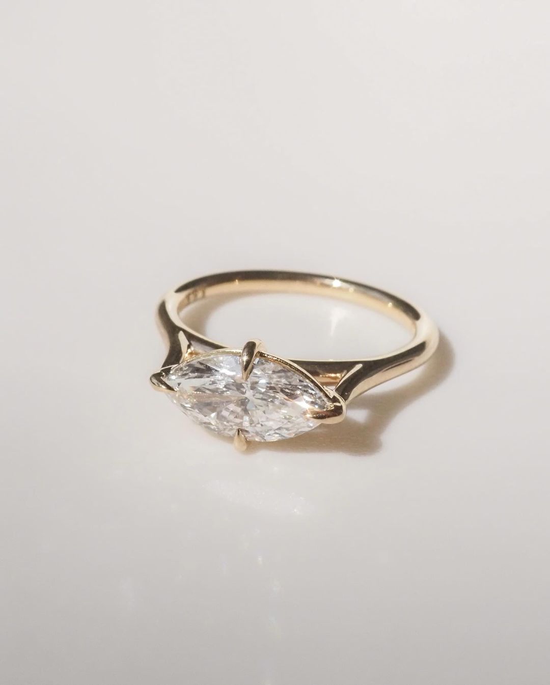 5.5ct Marquise Cut Lab Grown Diamond Solitaire Ring Close-up of an exquisite gold-band ring featuring a diamond, ideal for engagement celebrations or luxury jewelry enthusiasts. The soft manicure enhances the refined and elegant appeal. YouTube Amazon Facebook Weather Google Gmail Wordless WhatsApp Web Translate News blog post ring ceremony Article Life Money 2025 design Ring Ceremony Diamond Shape Diamond Ring Surat Diamond India Market Diamond Ring for Her Diamond Ring for Men Diamond Ring Women 