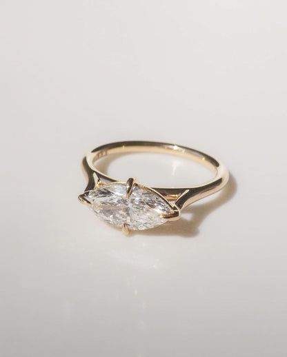 5.5ct Marquise Cut Lab Grown Diamond Solitaire Ring Close-up of an exquisite gold-band ring featuring a diamond, ideal for engagement celebrations or luxury jewelry enthusiasts. The soft manicure enhances the refined and elegant appeal. YouTube Amazon Facebook Weather Google Gmail Wordless WhatsApp Web Translate News blog post ring ceremony Article Life Money 2025 design Ring Ceremony Diamond Shape Diamond Ring Surat Diamond India Market Diamond Ring for Her Diamond Ring for Men Diamond Ring Women 