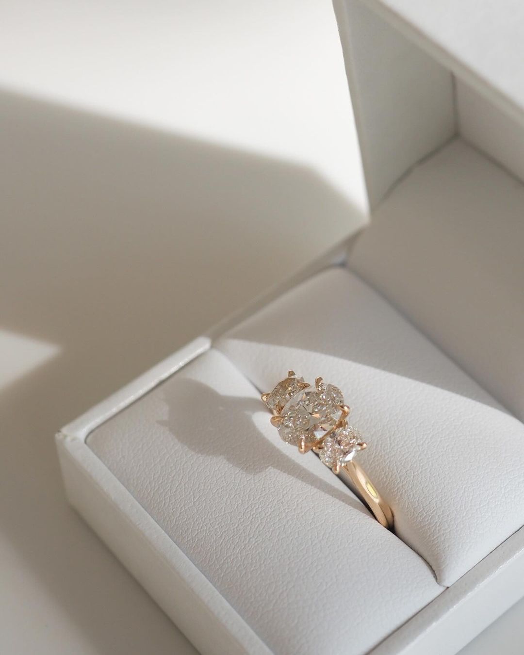 1.5ct Oval trio Diamond Ring Trio Ring with Center Stone with Oval Side Stones  Designer gold ring set with high-quality diamonds, perfect for gifting.  Beautifully crafted diamond and gold ring, blending tradition with contemporary style.  YouTube Amazon Facebook Weather Google Gmail Wordless WhatsApp Web Translate News blog post ring ceremony Article Life Money 2025 design Ring Ceremony Diamond Shape Diamond Ring Surat Diamond India Market Diamond Ring for Her Diamond Ring for Men Diamond Ring Women 