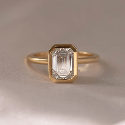 7ct Emerald Solitaire Full Bezel Lab Grown Diamond Ring  Designed to dazzle, the diamond’s brilliance makes it an ideal choice for engagements, weddings, anniversaries, or any special occasion. YouTube Amazon Facebook Weather Google Gmail Wordless WhatsApp Web Translate News blog post ring ceremony Article Life Money 2025 design Ring Ceremony Diamond Shape Diamond Ring Surat Diamond India Market Diamond Ring for Her Diamond Ring for Men Diamond Ring Women Engagement Ring Finger For Her Finger Ring Gold Ring