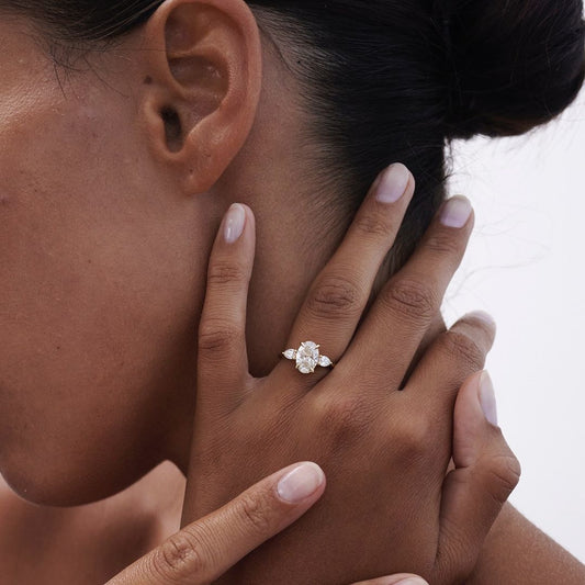 4.5ct Oval Center Stone with Two Side Pear Cut Lab Grown Diamond Ring Elegant diamond gold jewelry ring with intricate design, sparkling diamonds, and a polished gold finish, perfect for special occasions or everyday elegance YouTube Amazon Facebook Weather Google Gmail Wordless WhatsApp Web Translate News blog post ring ceremony Article Life Money 2025 design Ring Ceremony Diamond Shape Diamond Ring Surat Diamond India Market Diamond Ring for Her Diamond Ring for Men Diamond Ring Women Engagement Ring 